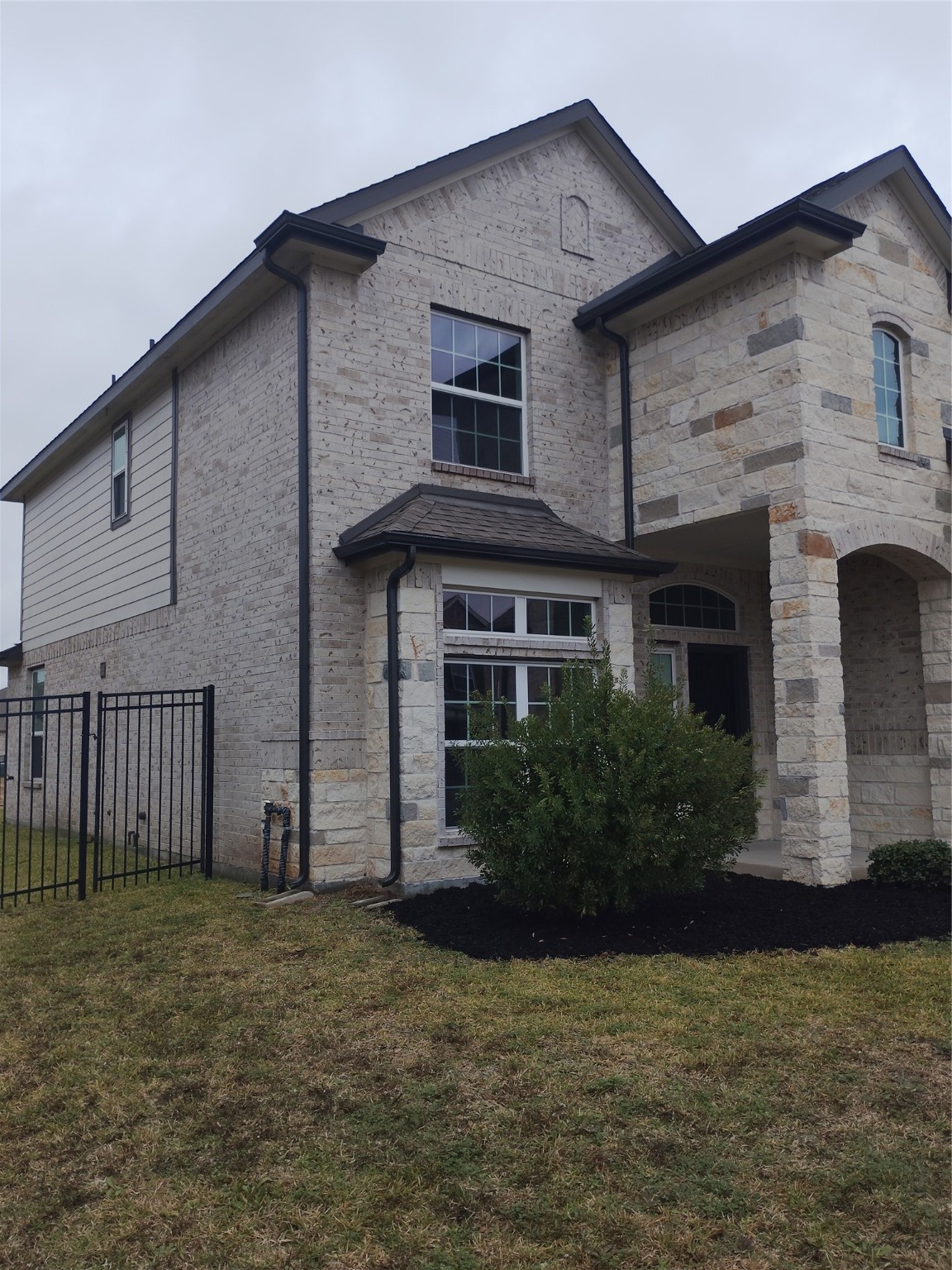 85 Carmel Drive Manvel, TX 77578 - Photo 3 of 31 a front view of a house with a yard