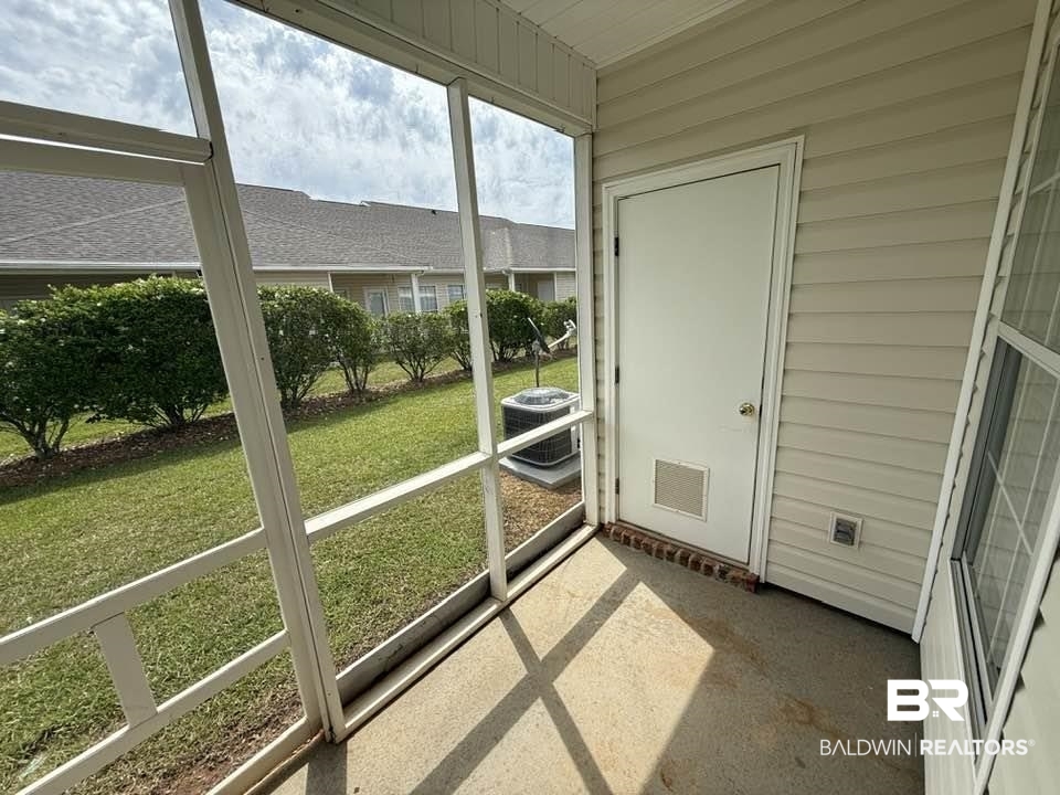 2651 South Juniper Street, Unit 401 Foley, AL 36535 - Photo 5 of 27 Unfurnished sunroom featuring visible vents