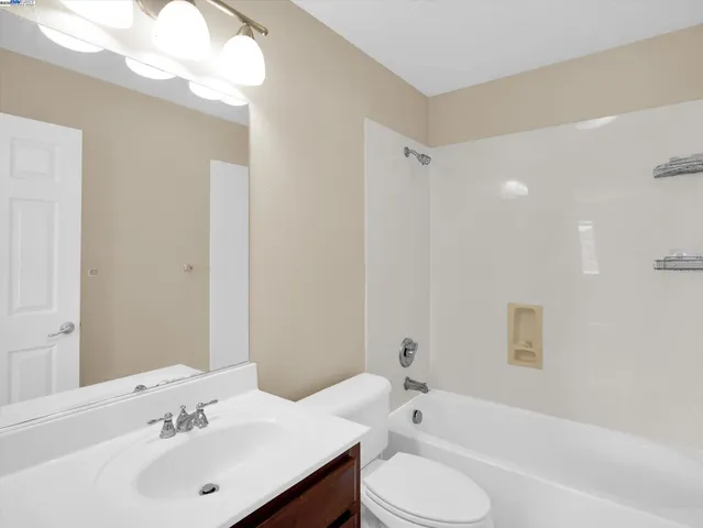 a bathroom with a sink toilet and bathtub