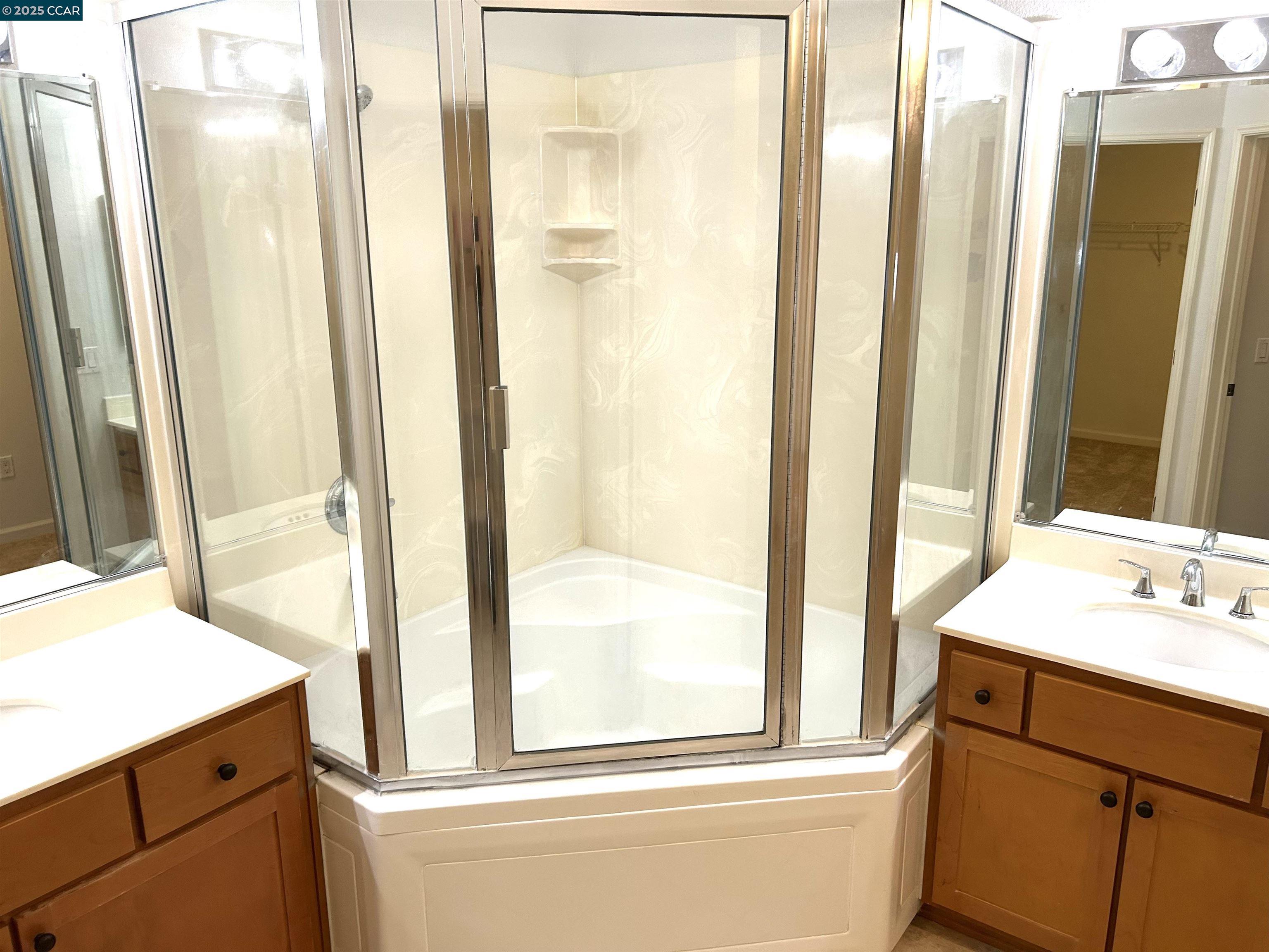 1310 Saddle Rack Street, Unit 352 San Jose, CA 95126 - Photo 11 of 41 a bathroom with a sink a mirror and a shower