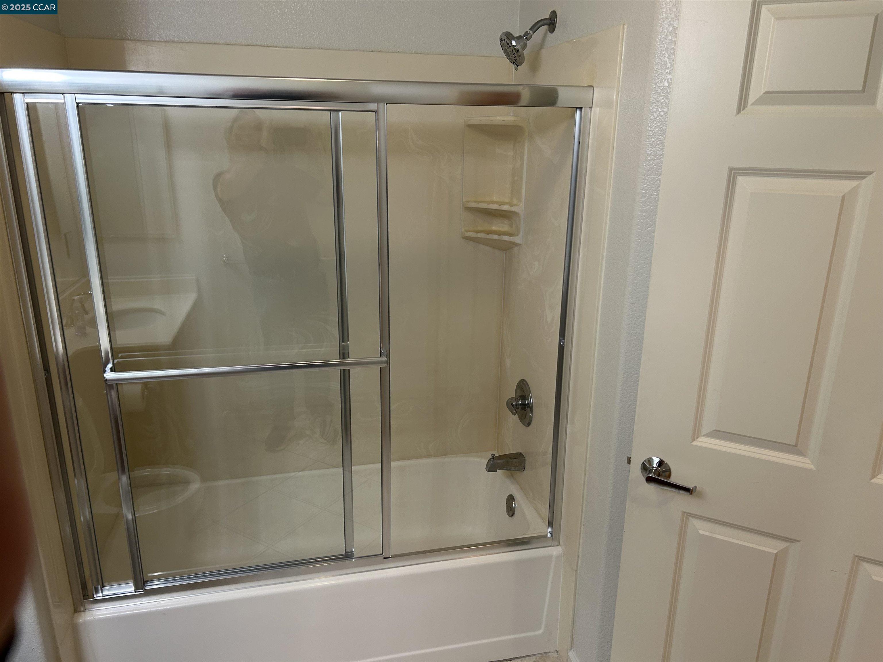 1310 Saddle Rack Street, Unit 352 San Jose, CA 95126 - Photo 17 of 41 a bathroom with a glass shower door