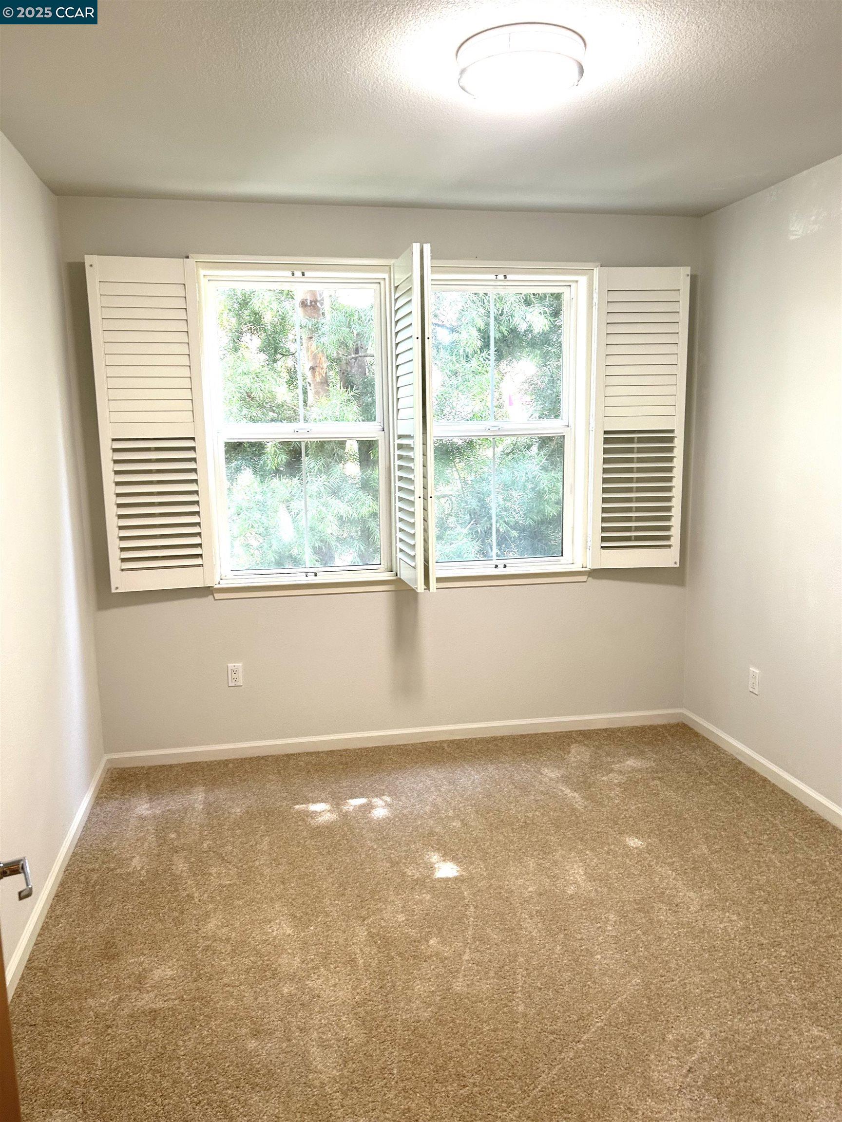 1310 Saddle Rack Street, Unit 352 San Jose, CA 95126 - Photo 19 of 41 a view of an empty room with a window