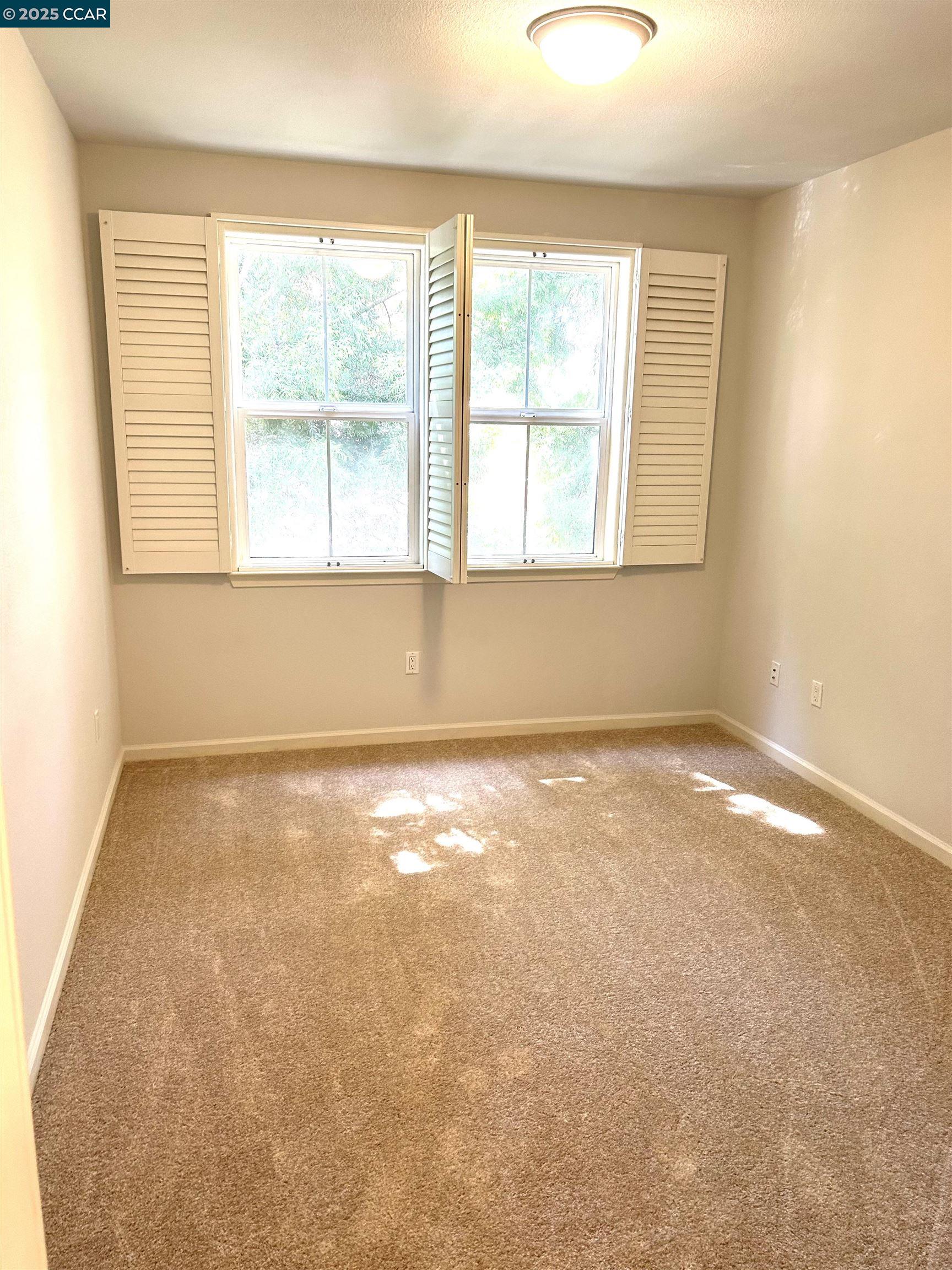 1310 Saddle Rack Street, Unit 352 San Jose, CA 95126 - Photo 21 of 41 an empty room with a window