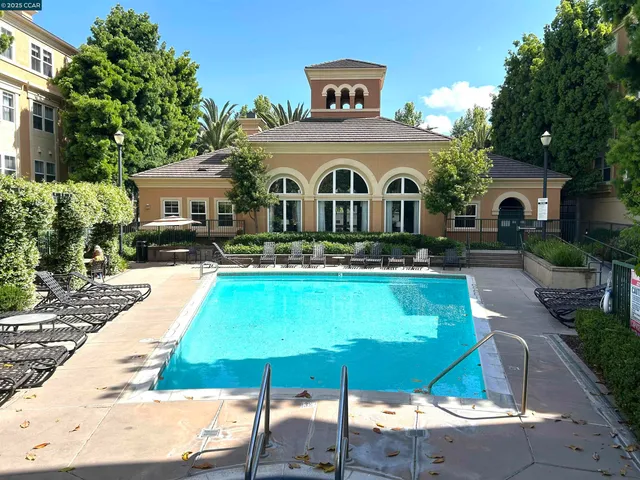 a view of a backyard with sitting area