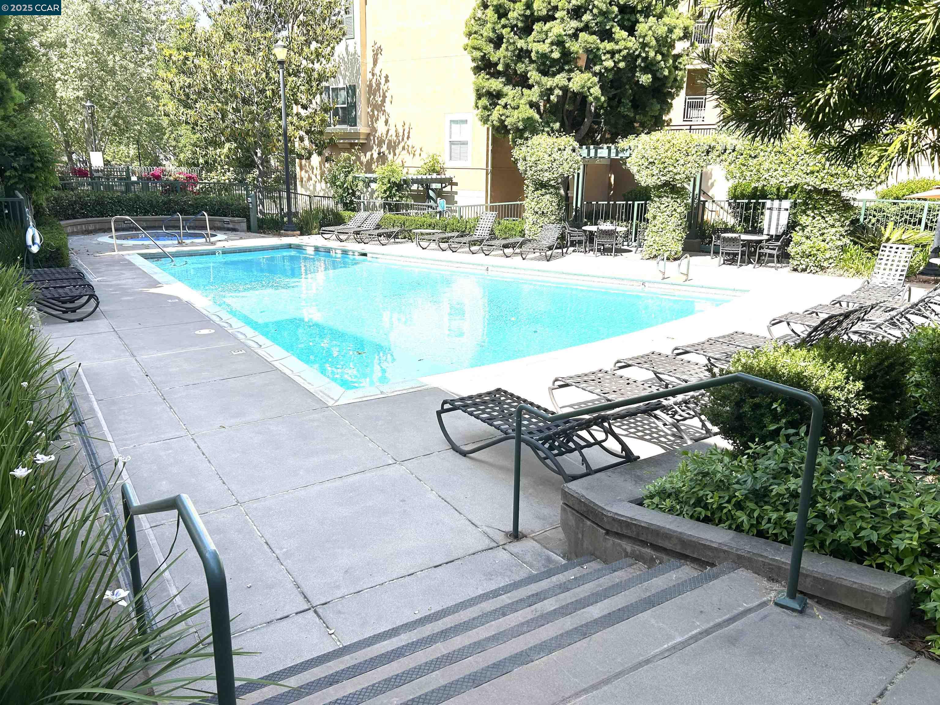 1310 Saddle Rack Street, Unit 352 San Jose, CA 95126 - Photo 27 of 41 a view of a swimming pool with lounge chair