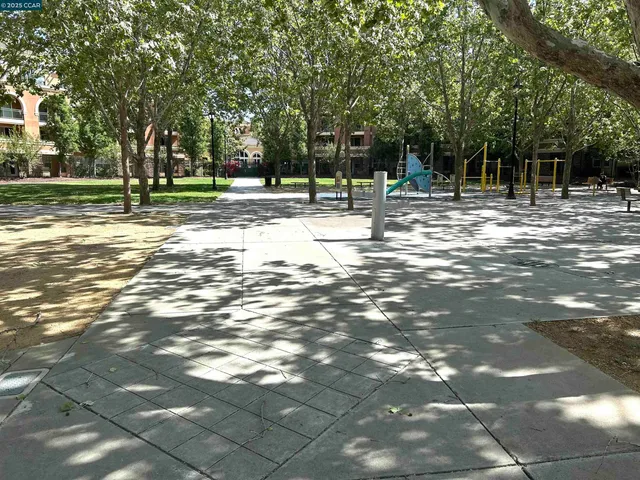 a view of a park with swings and slides