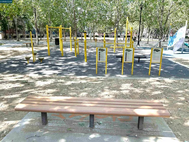 a view of outdoor space with playground and green space