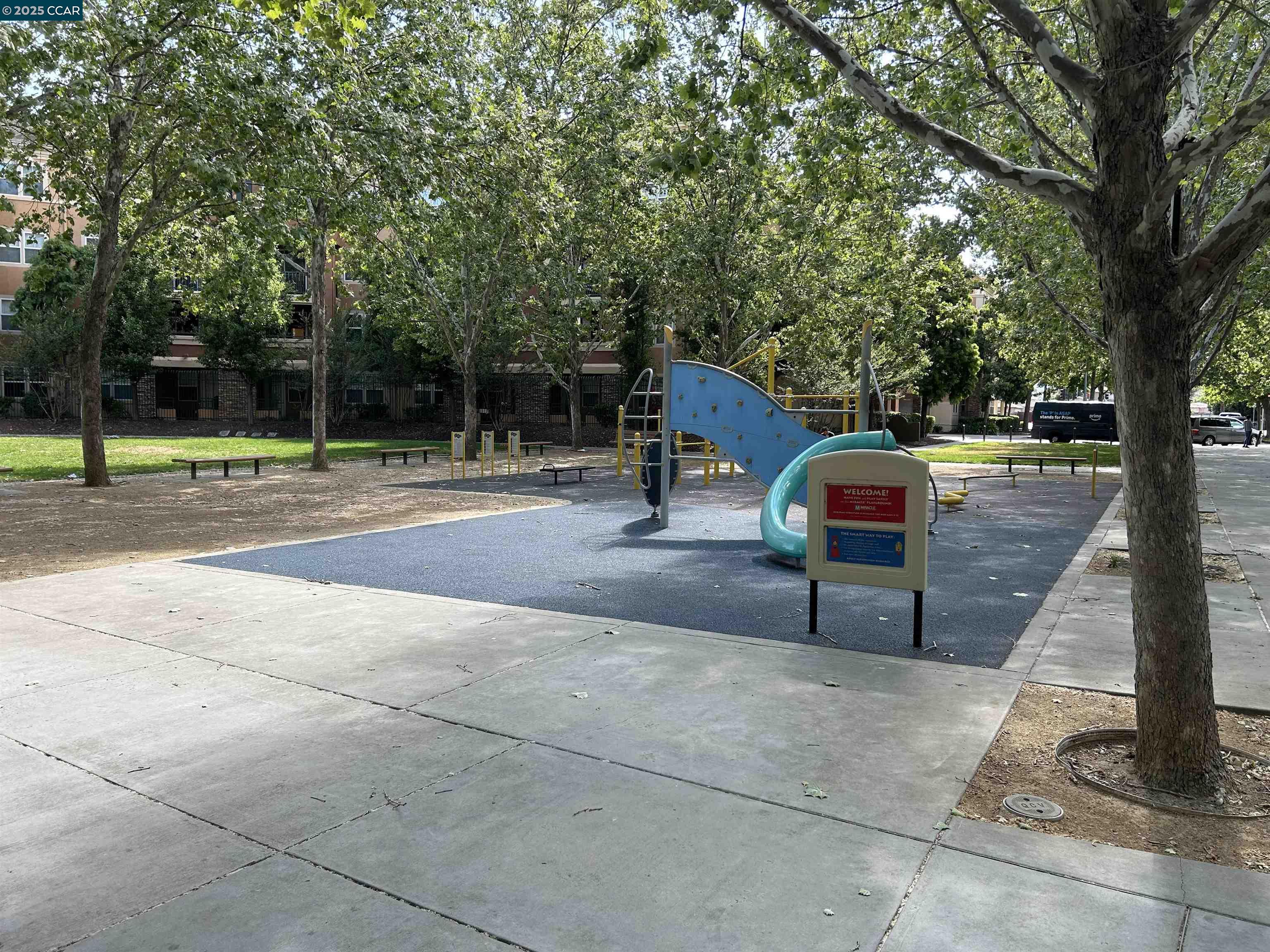 1310 Saddle Rack Street, Unit 352 San Jose, CA 95126 - Photo 33 of 41 a backyard of a house with table and chairs