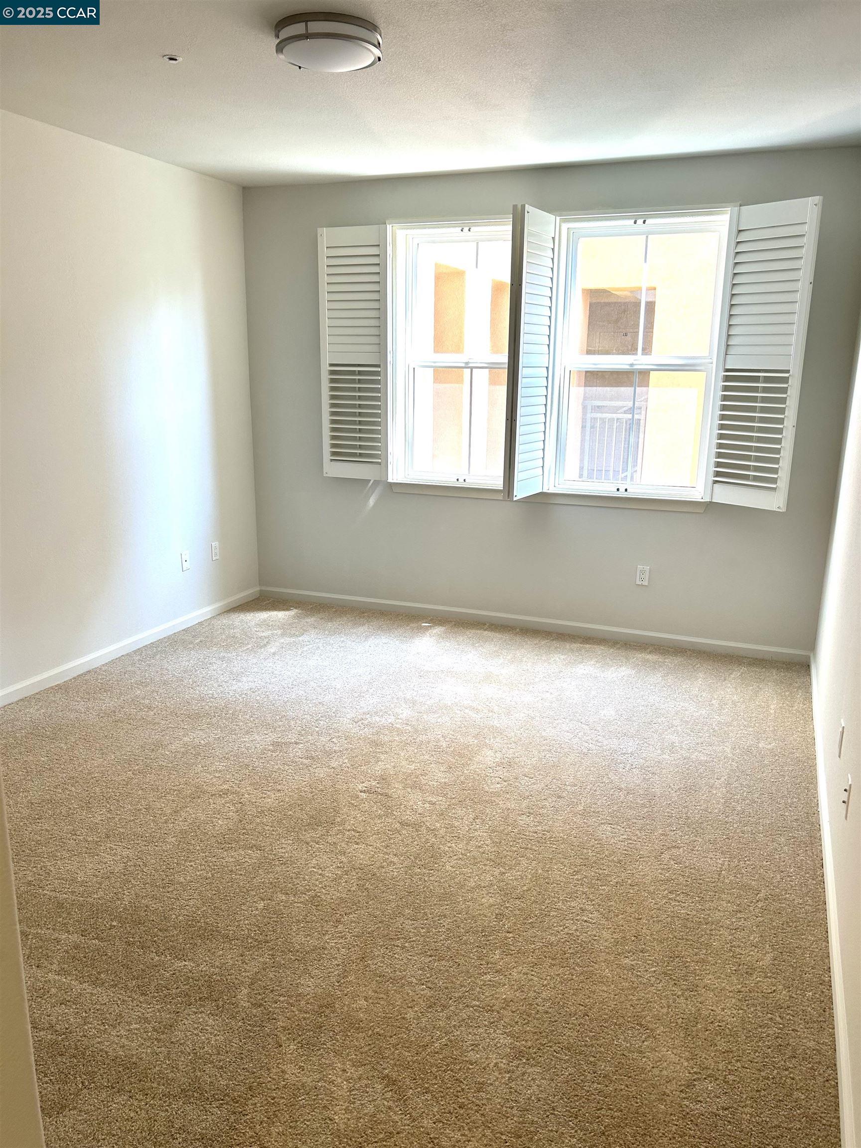 1310 Saddle Rack Street, Unit 352 San Jose, CA 95126 - Photo 9 of 41 an empty room with windows