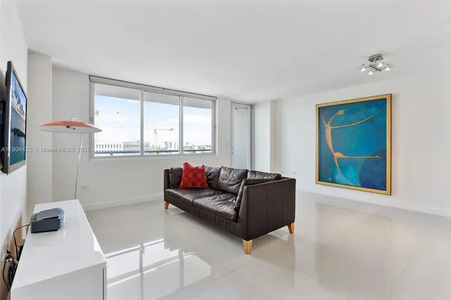 a living room with furniture and a window