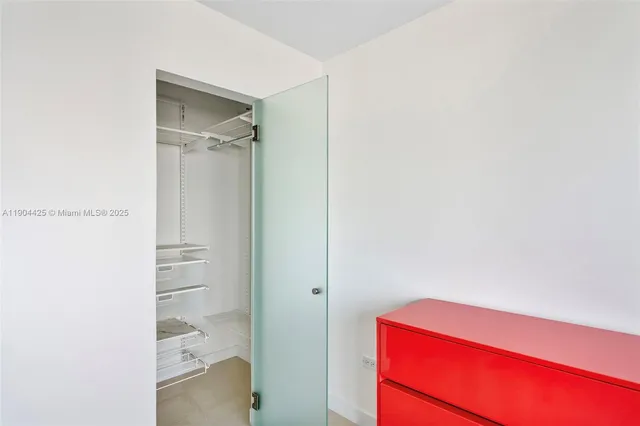 a bathroom with a shower and a sink