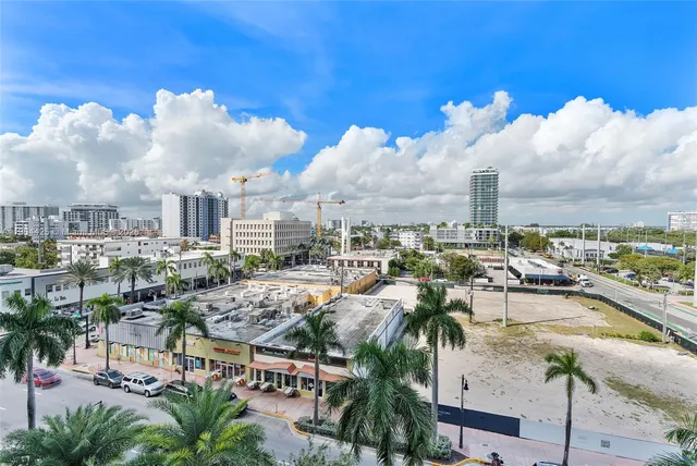 a city view with lot of cars parked