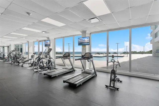 an aerial view of a residential apartment building with a yard