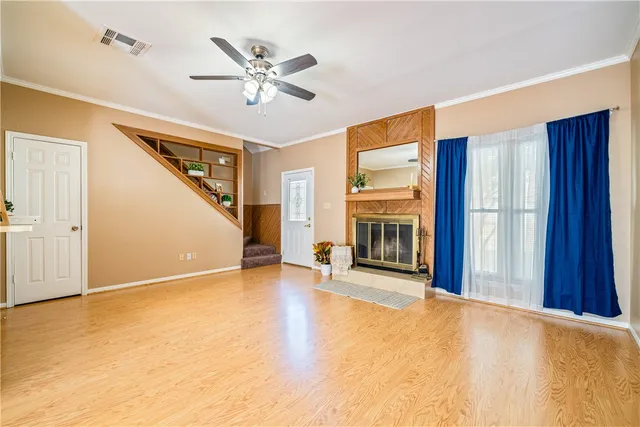 a view of an empty room with a fireplace