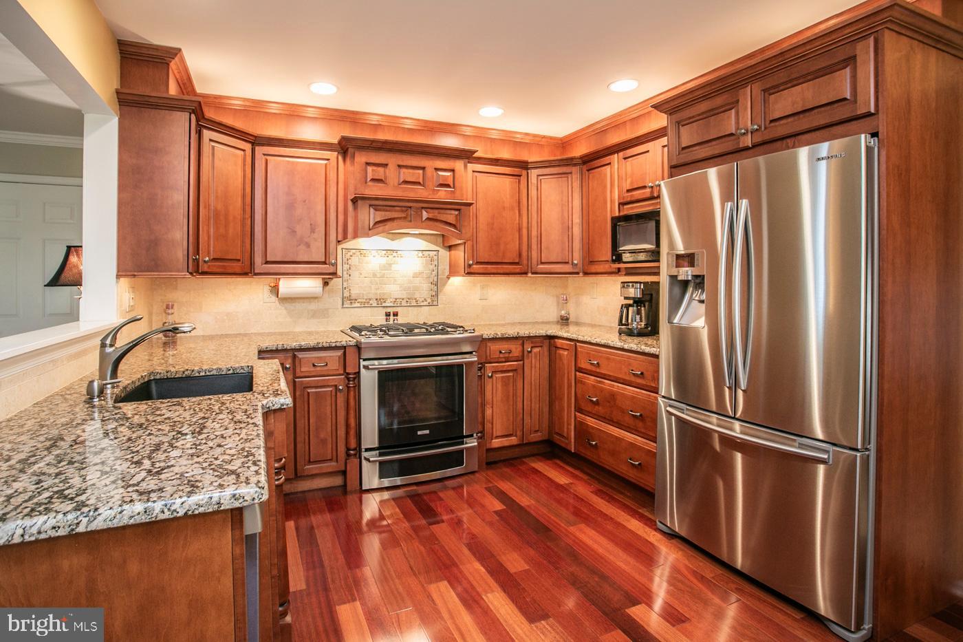 116 Summer Ridge Drive Lansdale, PA 19446 - Photo 18 of 52 a kitchen with granite countertop stainless steel appliances a sink and counter space