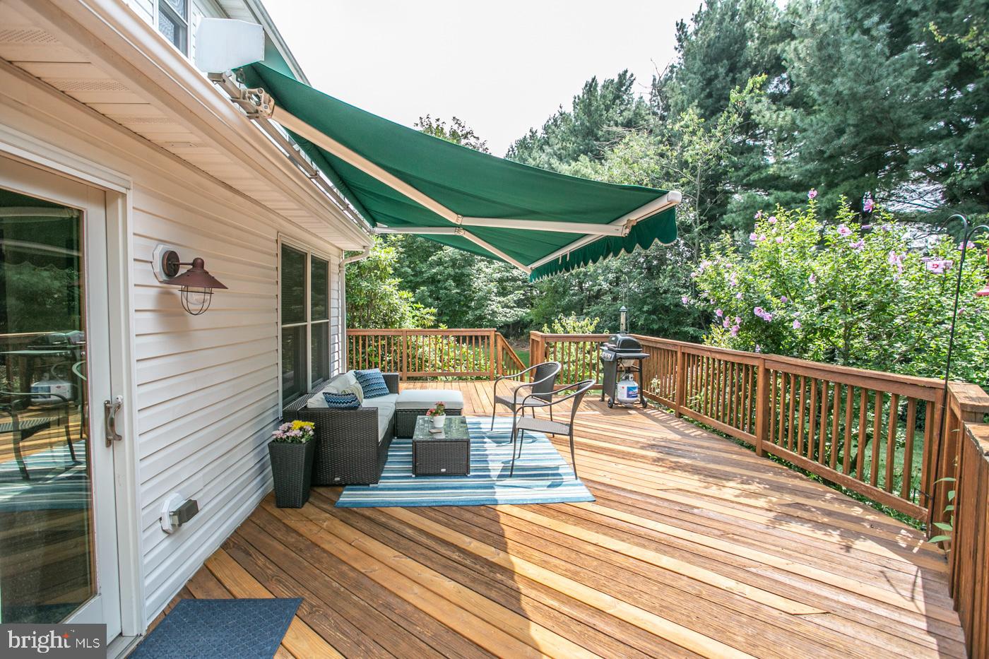 116 Summer Ridge Drive Lansdale, PA 19446 - Photo 43 of 52 a view of a patio with table and chairs with wooden floor and fence