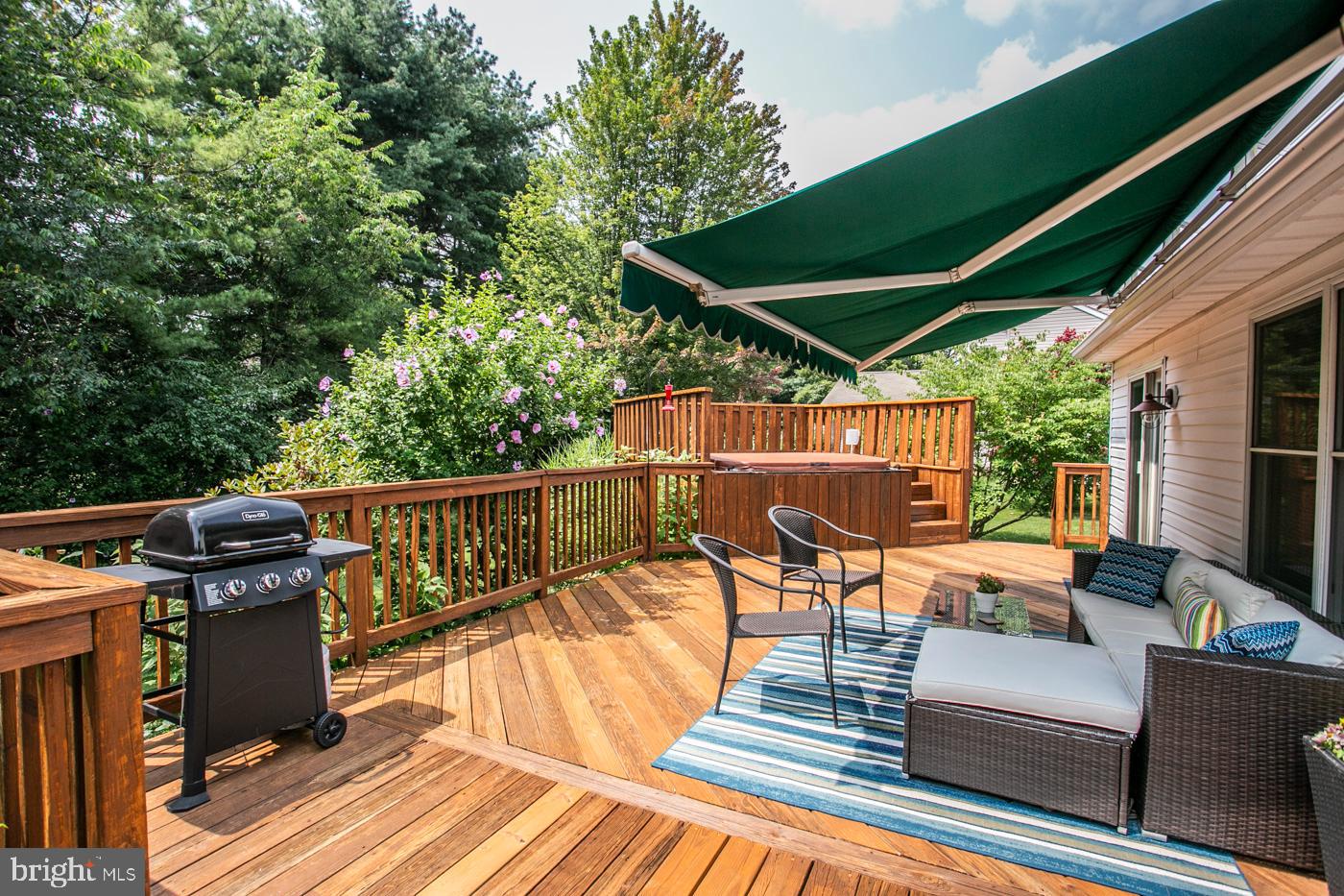 116 Summer Ridge Drive Lansdale, PA 19446 - Photo 46 of 52 a view of a patio with table and chairs a barbeque with wooden floor and fence