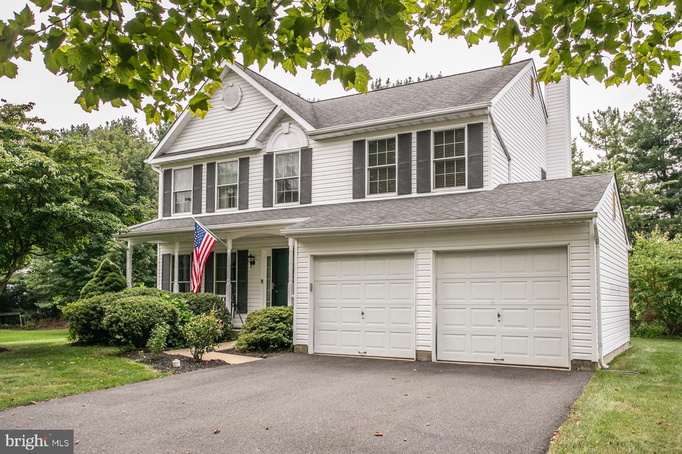 116 Summer Ridge Drive Lansdale, PA 19446 - Photo 5 of 52 a view of a white house with a yard and large trees