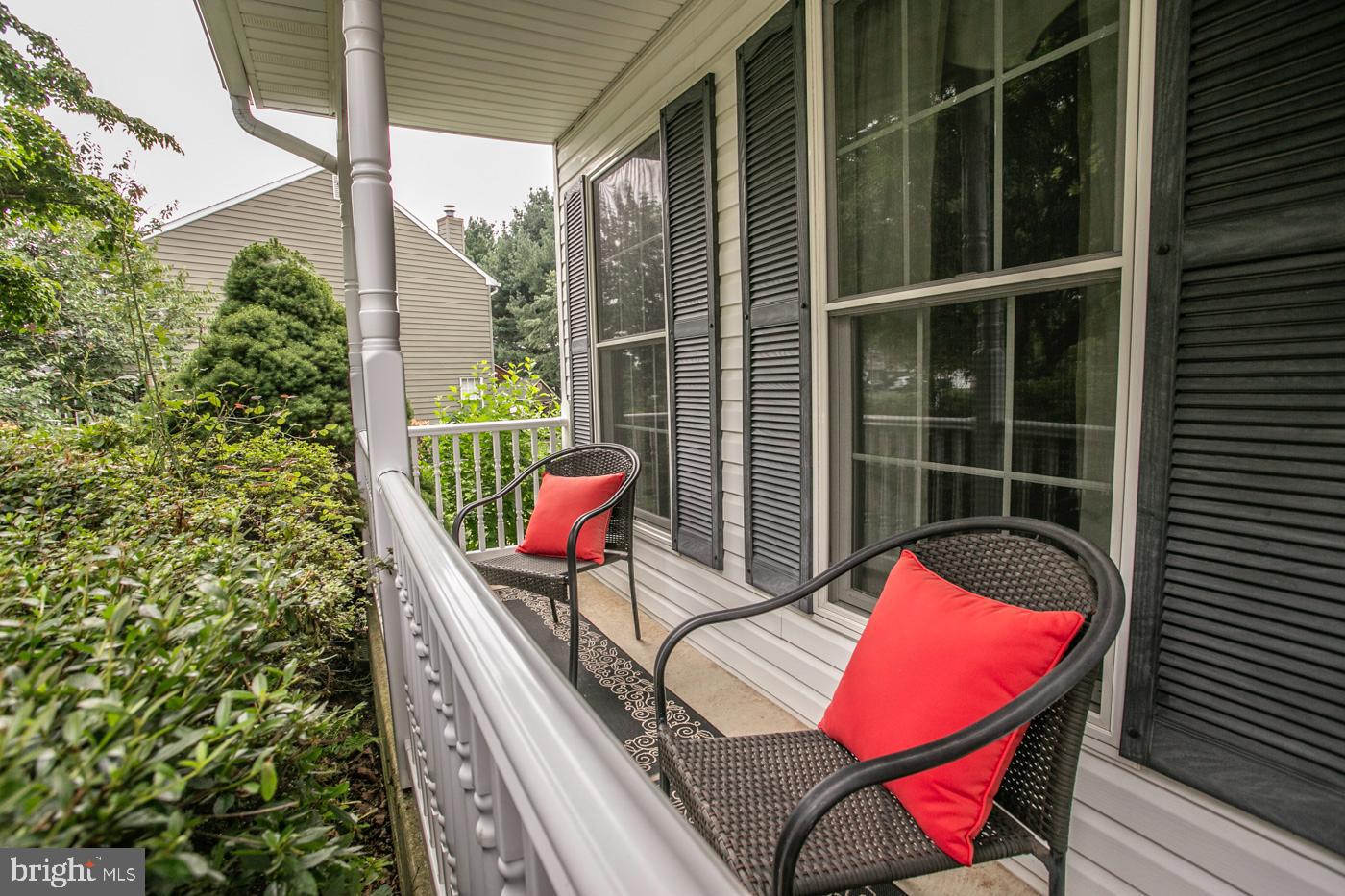 116 Summer Ridge Drive Lansdale, PA 19446 - Photo 7 of 52 a view of a balcony with chair and the potted plant