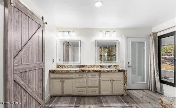 a kitchen with cabinets and a stove top oven