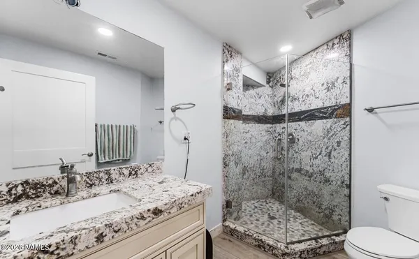 a view of a house with a wooden deck