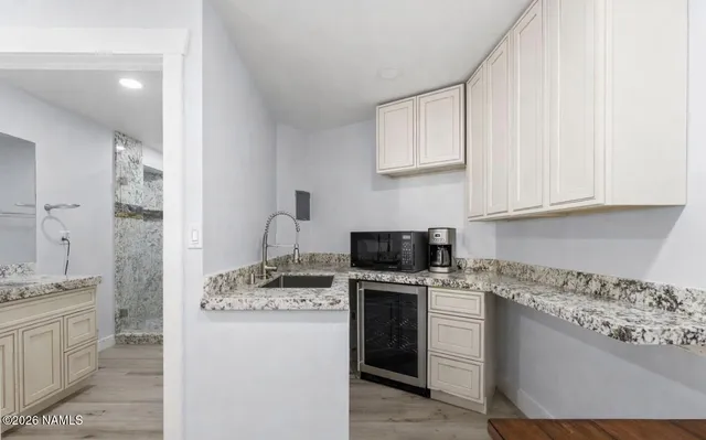 a view of a room with table and chairs