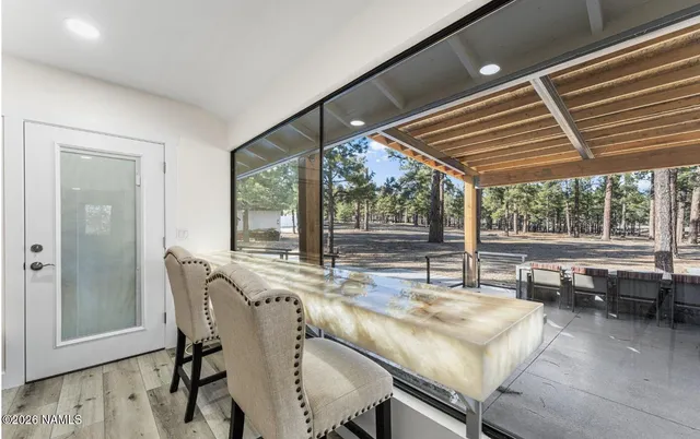a dining room with furniture and a window
