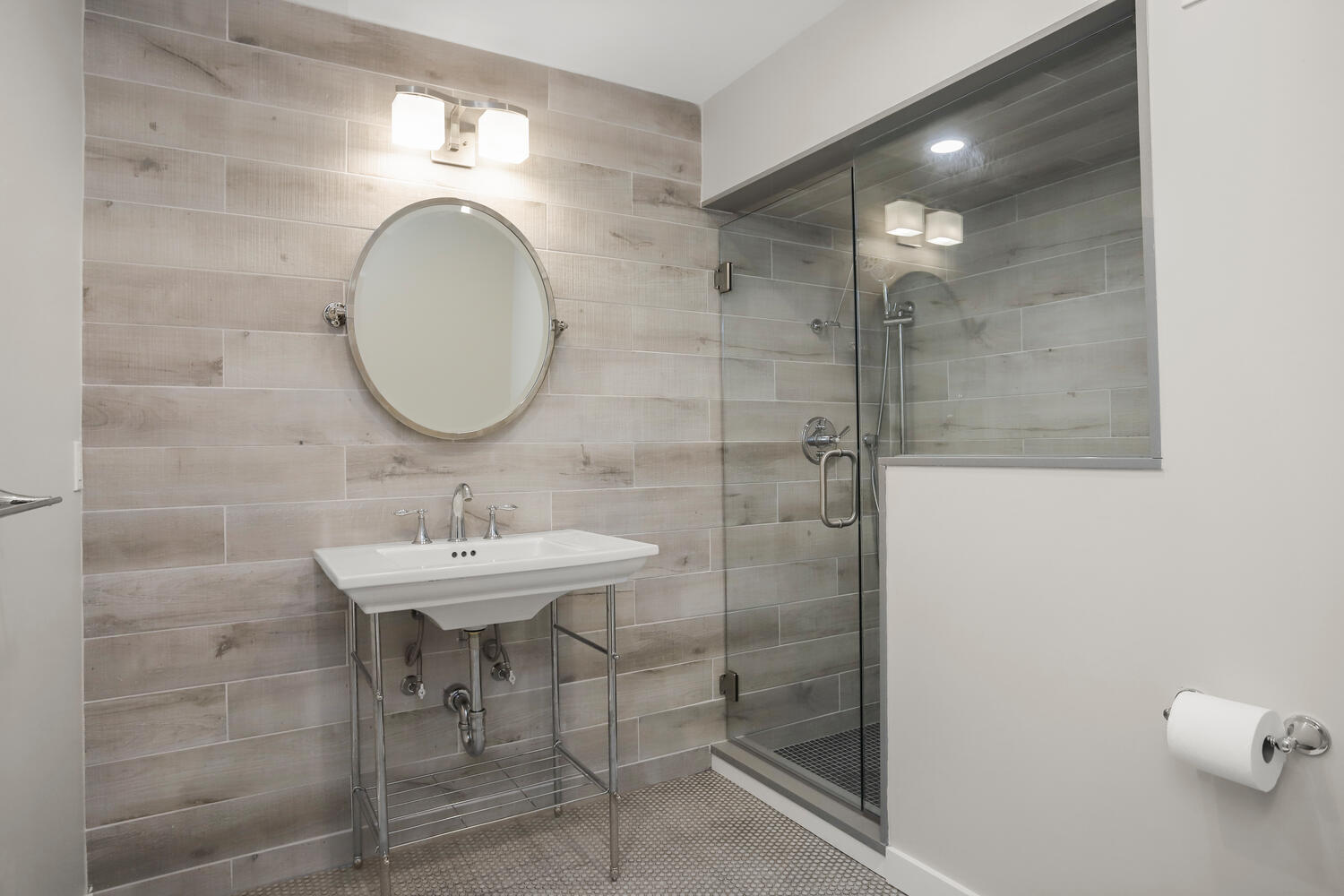 538 Laurel Road New Canaan, CT 06840 - Photo 14 of 28 a bathroom with a sink a mirror and shower