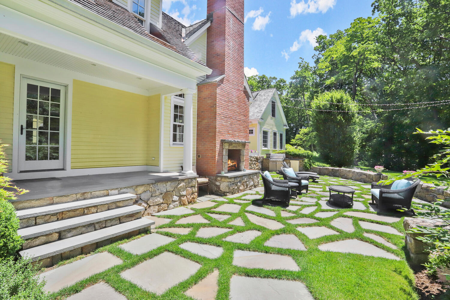 538 Laurel Road New Canaan, CT 06840 - Photo 20 of 28 a view of a patio with couches table and chairs and potted plants