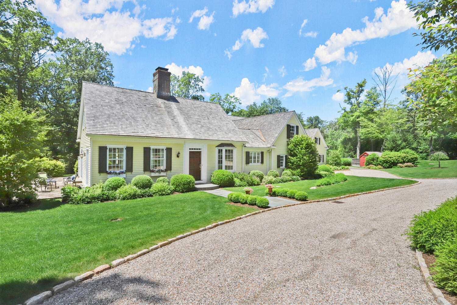 538 Laurel Road New Canaan, CT 06840 - Photo 23 of 28 a front view of house with yard and green space
