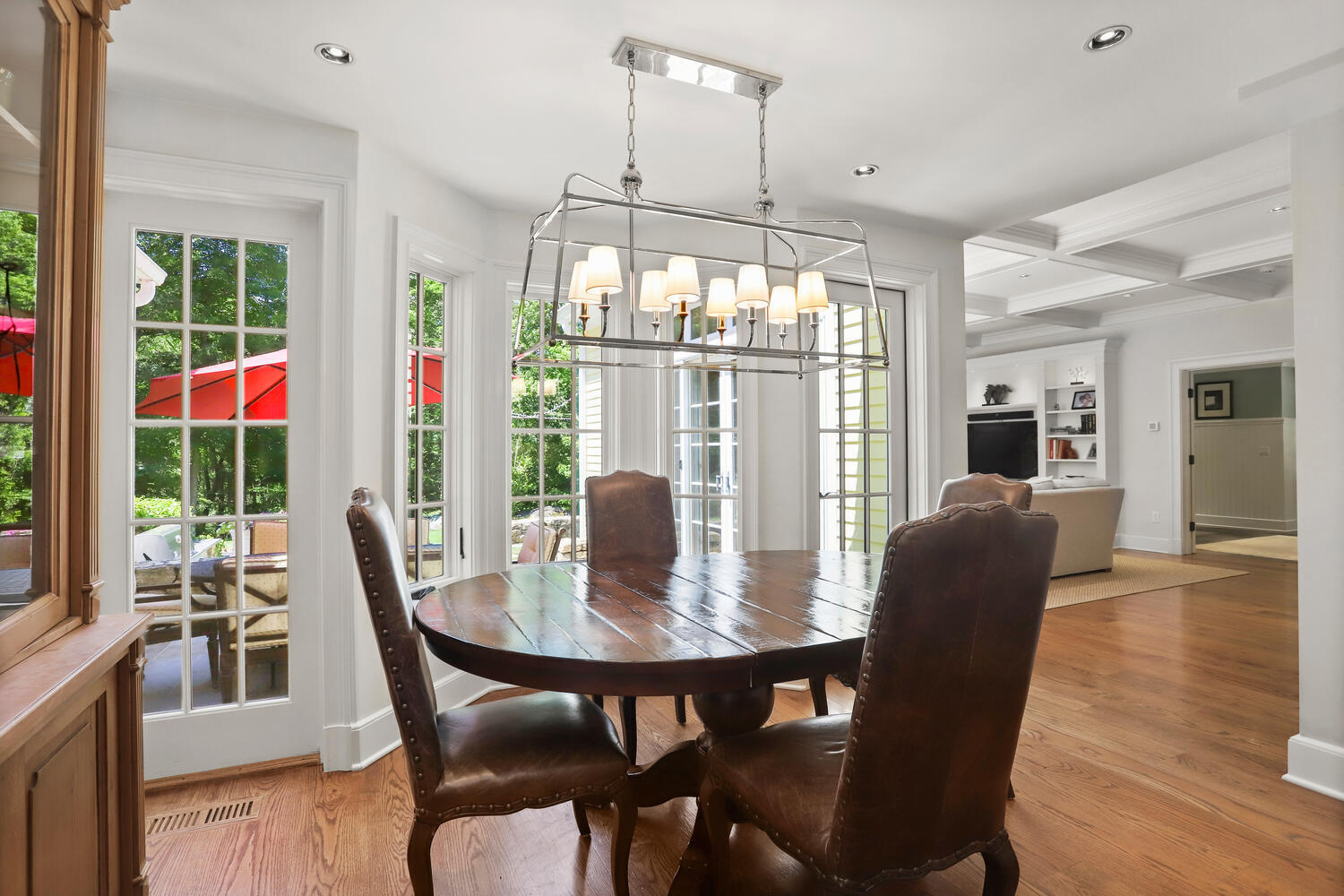 538 Laurel Road New Canaan, CT 06840 - Photo 5 of 28 a view of a dining room with furniture wooden floor and chandelier