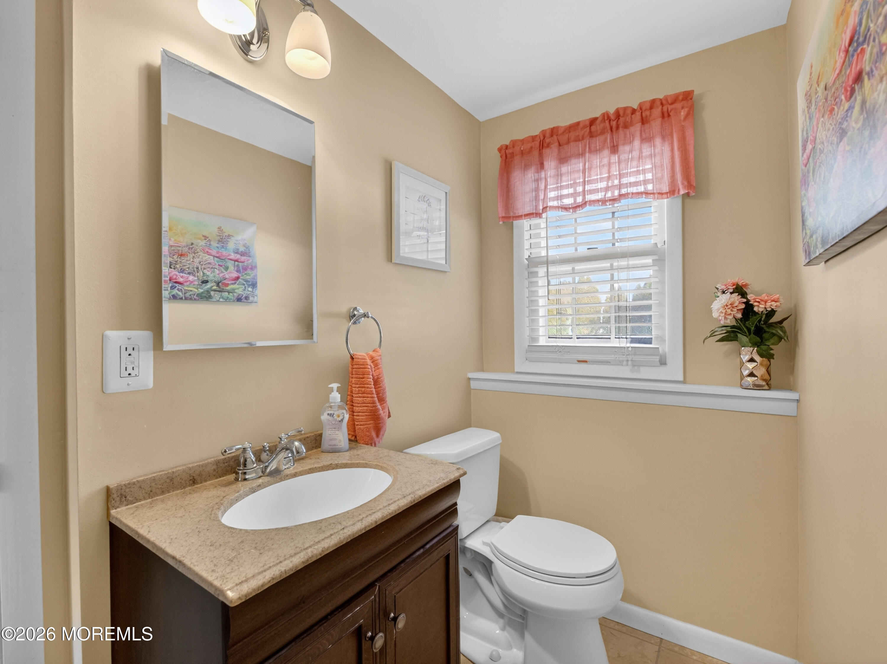 417 Crestview Terrace Brick, NJ 08723 - Photo 21 of 35 a bathroom with a toilet a sink and a mirror
