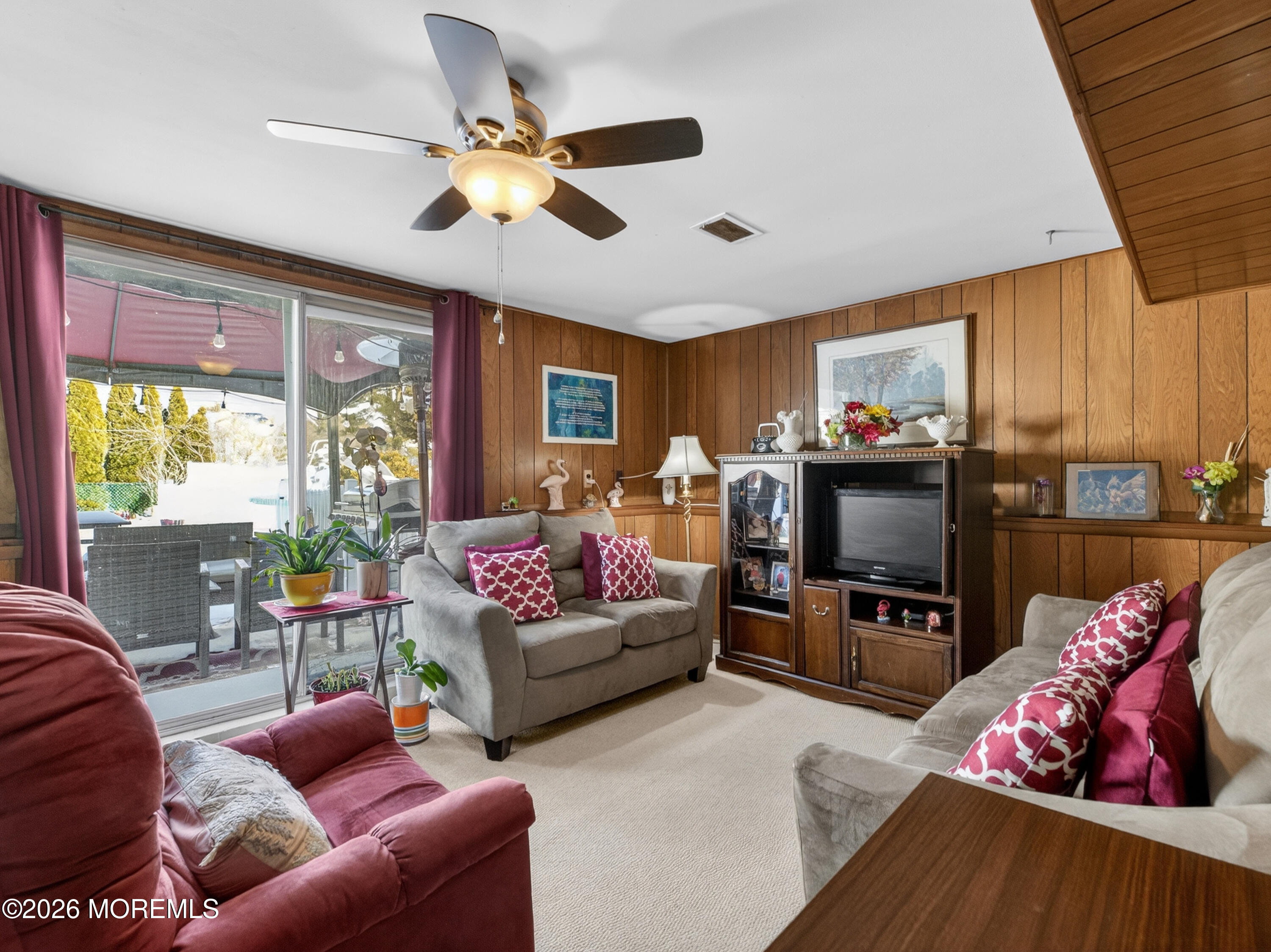 417 Crestview Terrace Brick, NJ 08723 - Photo 26 of 35 a living room with furniture a flat screen tv and a large window