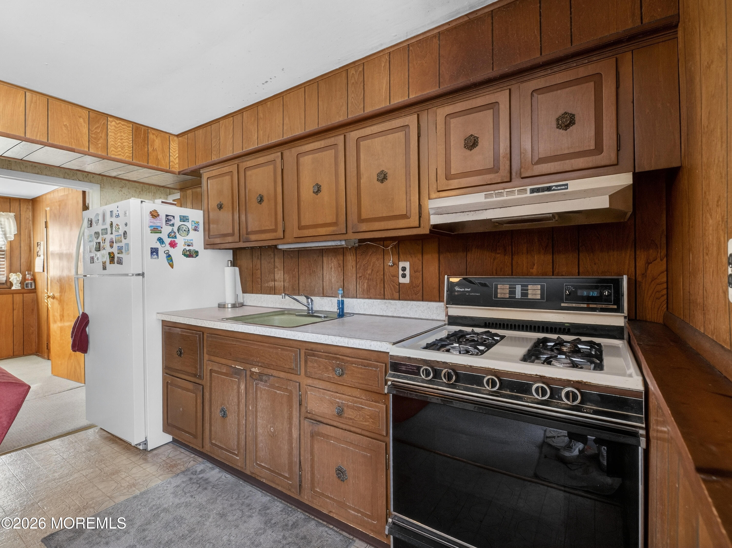 417 Crestview Terrace Brick, NJ 08723 - Photo 27 of 35 a kitchen with stainless steel appliances granite countertop a stove and a refrigerator