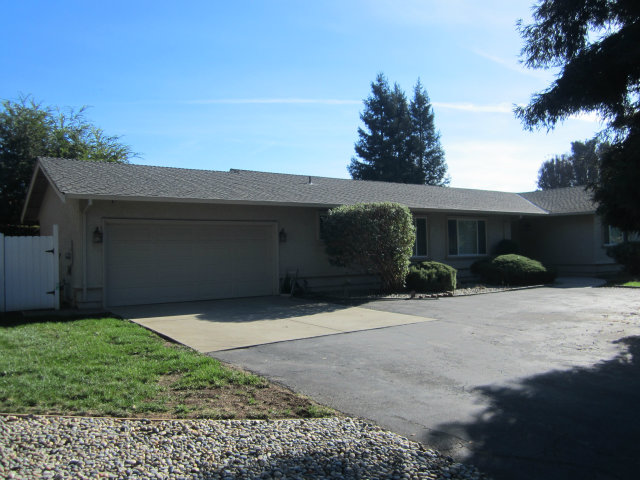 2460 Scarlet Road Gilroy, CA 95020 - Photo 2 of 15 a front view of a house with a yard and garage