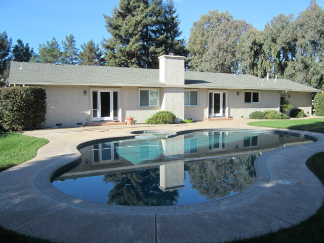 2460 Scarlet Road Gilroy, CA 95020 - Photo 5 of 15 a front view of a house with garden