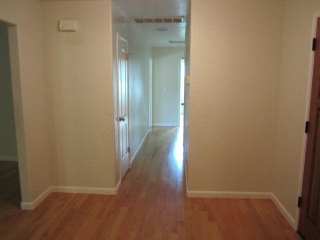 2460 Scarlet Road Gilroy, CA 95020 - Photo 9 of 15 a view of a hallway with wooden floor