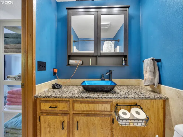 a kitchen with a granite countertop sink and a granite counter tops