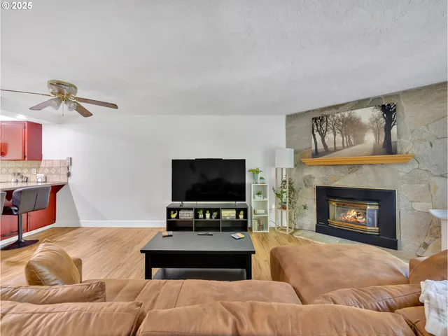 a living room with furniture and a fireplace