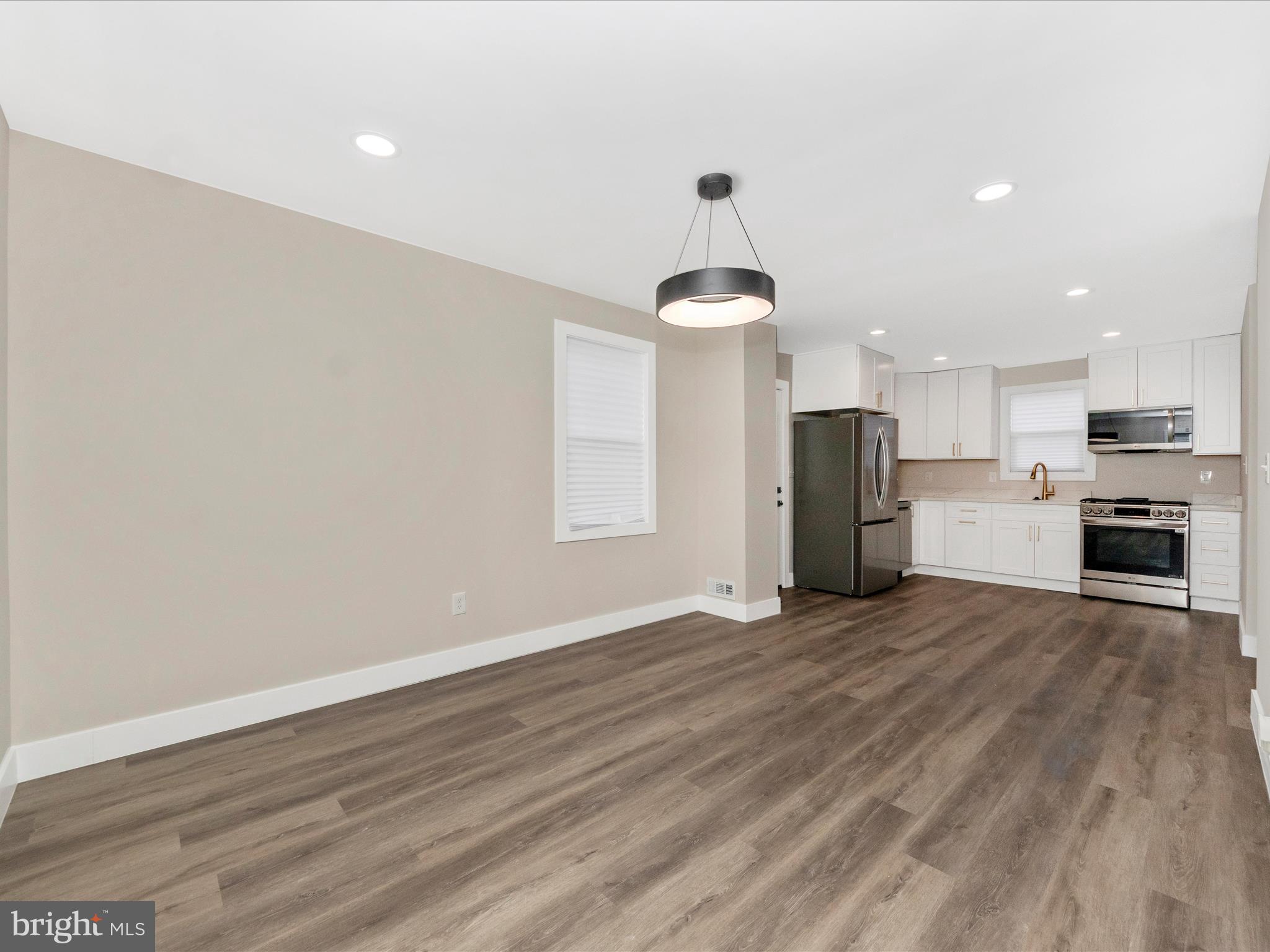 2812 Manoff Road Halethorpe, MD 21227 - Photo 12 of 55 a view of a kitchen with a sink and a refrigerator