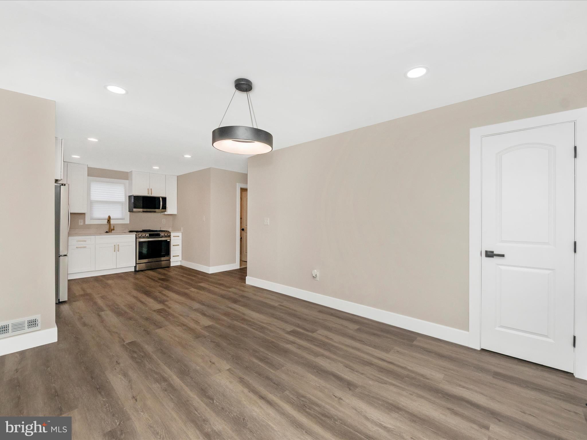 2812 Manoff Road Halethorpe, MD 21227 - Photo 13 of 55 a view of a kitchen with a sink and a refrigerator