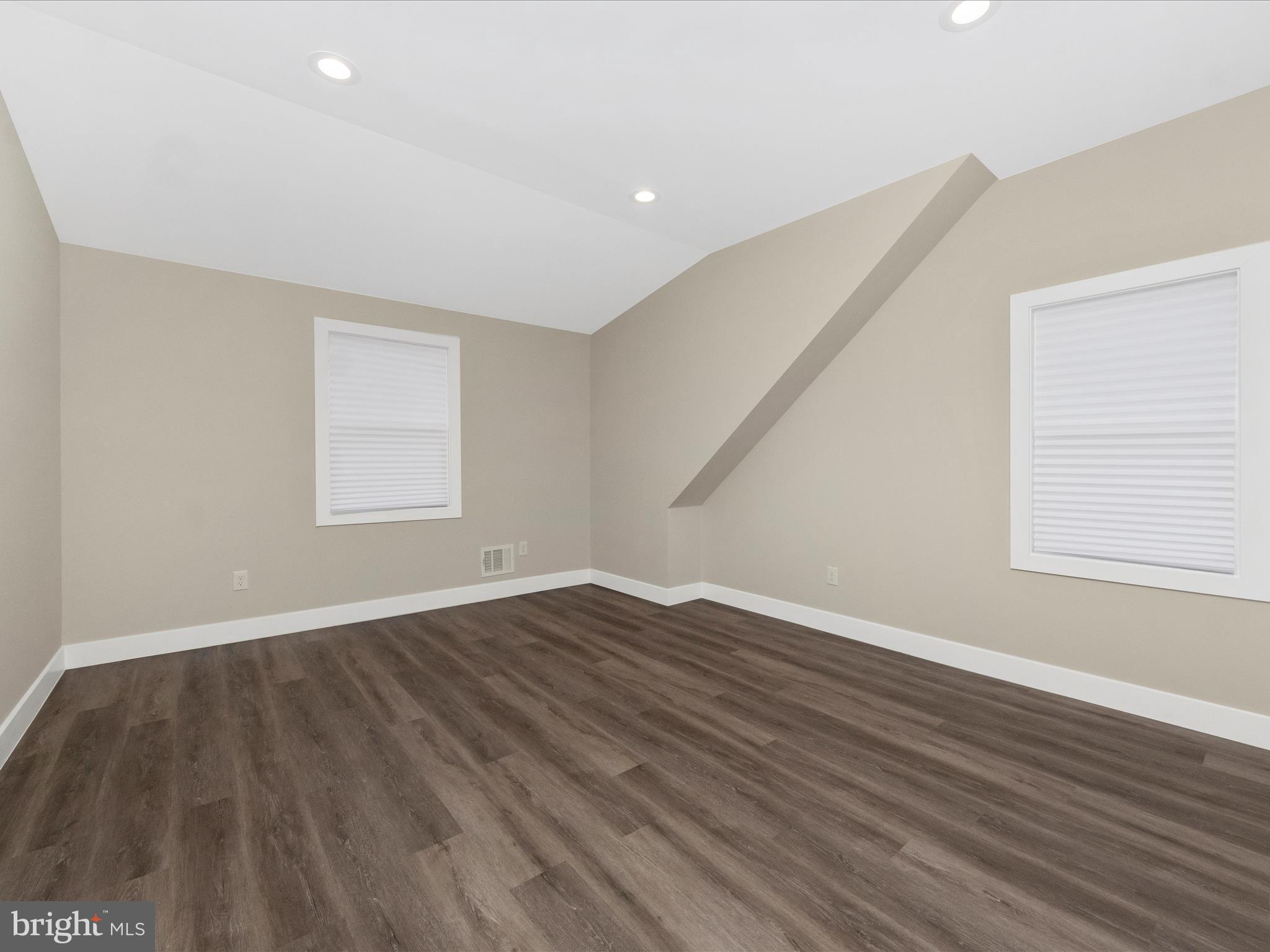 2812 Manoff Road Halethorpe, MD 21227 - Photo 14 of 55 a view of an empty room with wooden floor and a window