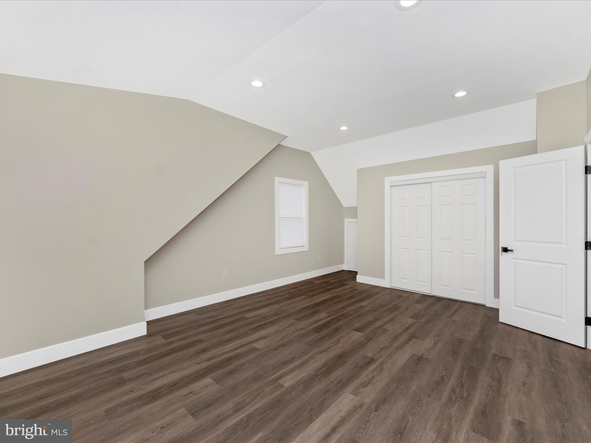 2812 Manoff Road Halethorpe, MD 21227 - Photo 16 of 55 a view of an empty room with wooden floor and closet