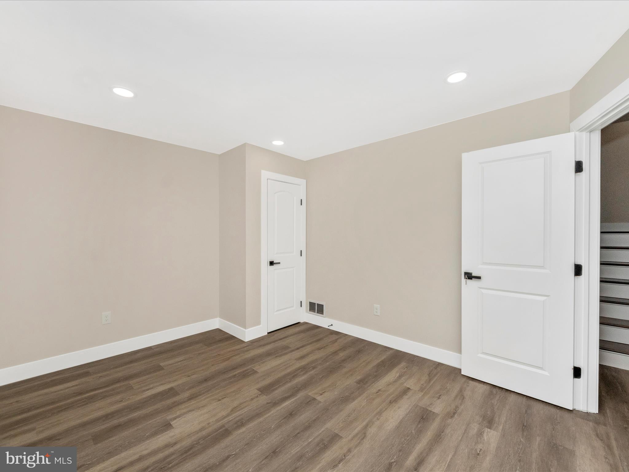 2812 Manoff Road Halethorpe, MD 21227 - Photo 20 of 55 a view of an empty room with wooden floor