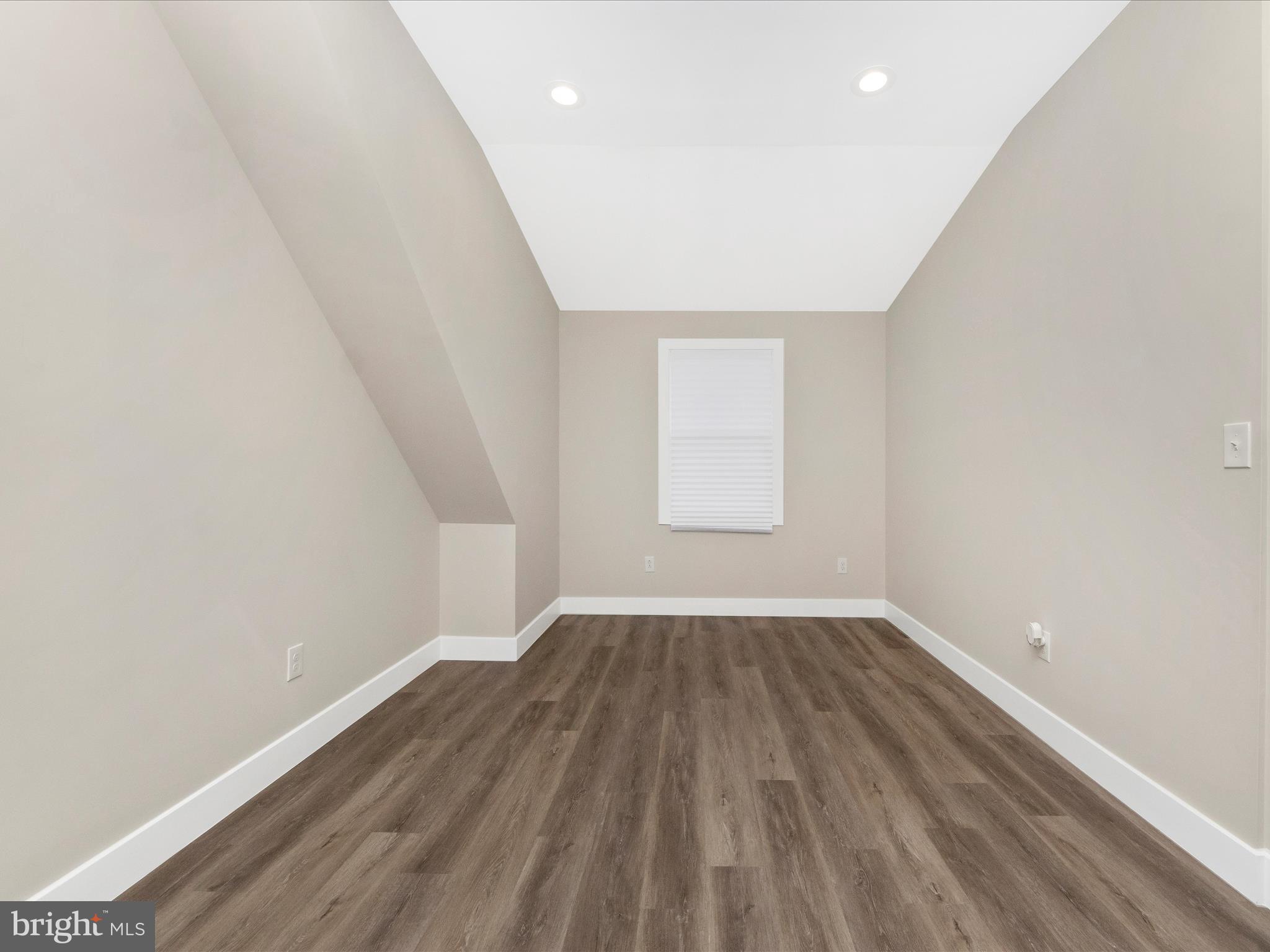 2812 Manoff Road Halethorpe, MD 21227 - Photo 23 of 55 an empty room with wooden floor and windows