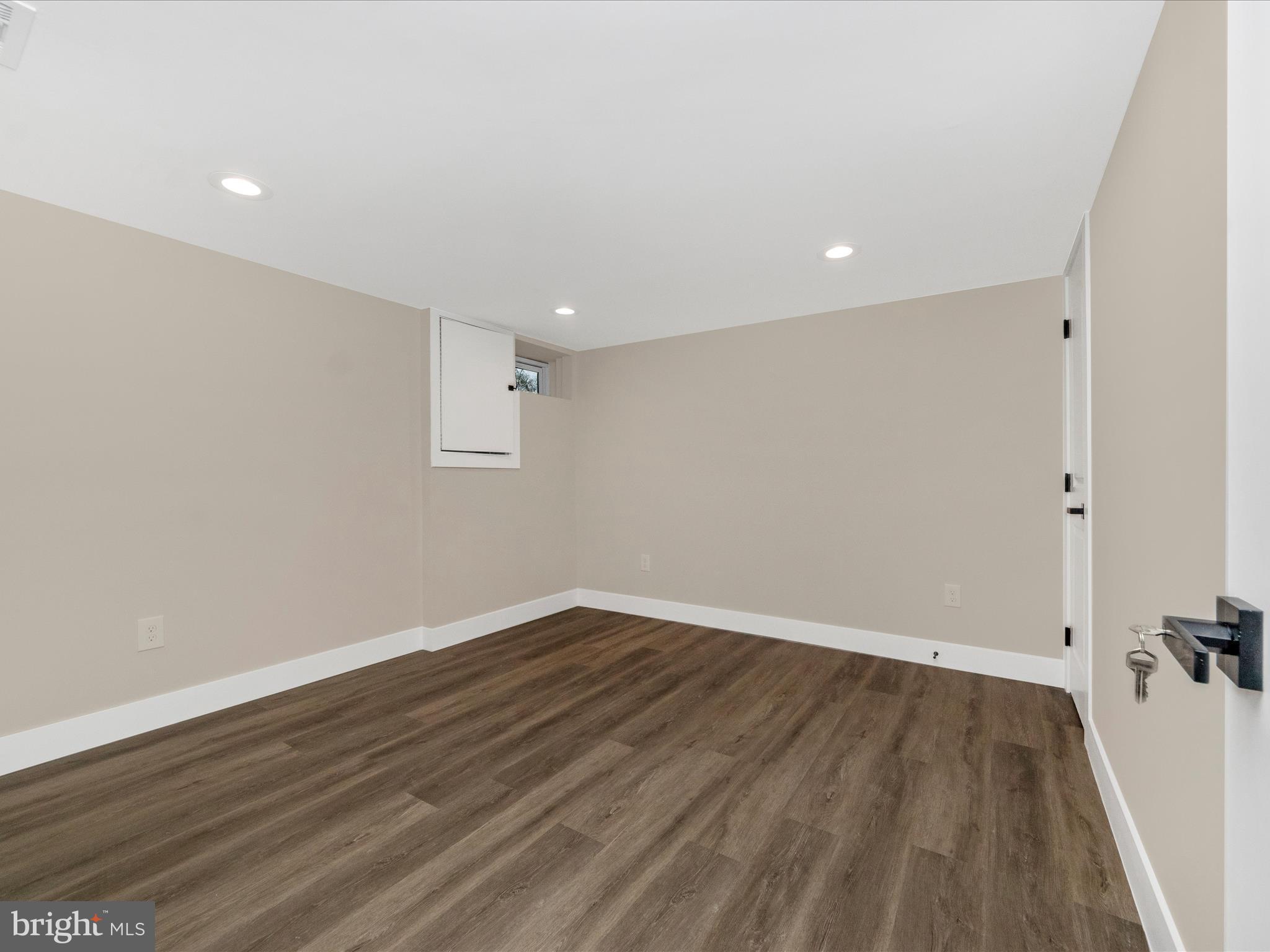 2812 Manoff Road Halethorpe, MD 21227 - Photo 25 of 55 a view of room with wooden floor and window