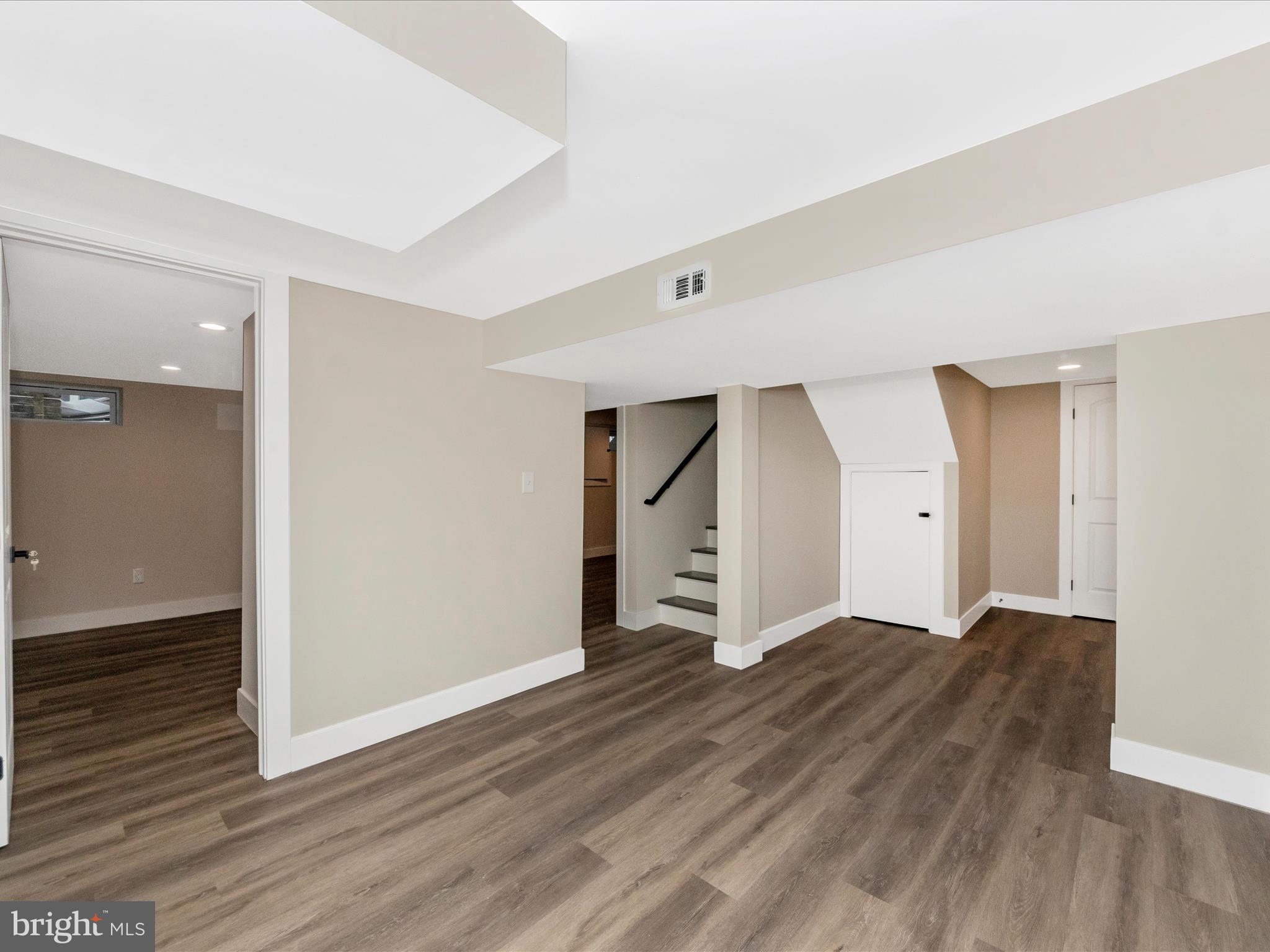 2812 Manoff Road Halethorpe, MD 21227 - Photo 28 of 55 an empty room with wooden floor and closet