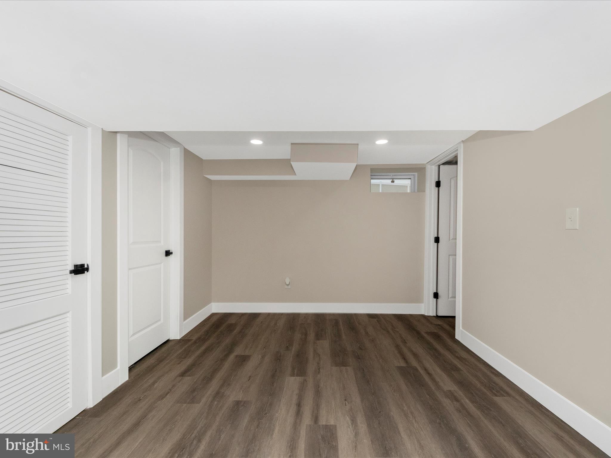 2812 Manoff Road Halethorpe, MD 21227 - Photo 29 of 55 a view of a room with wooden floor and white walls