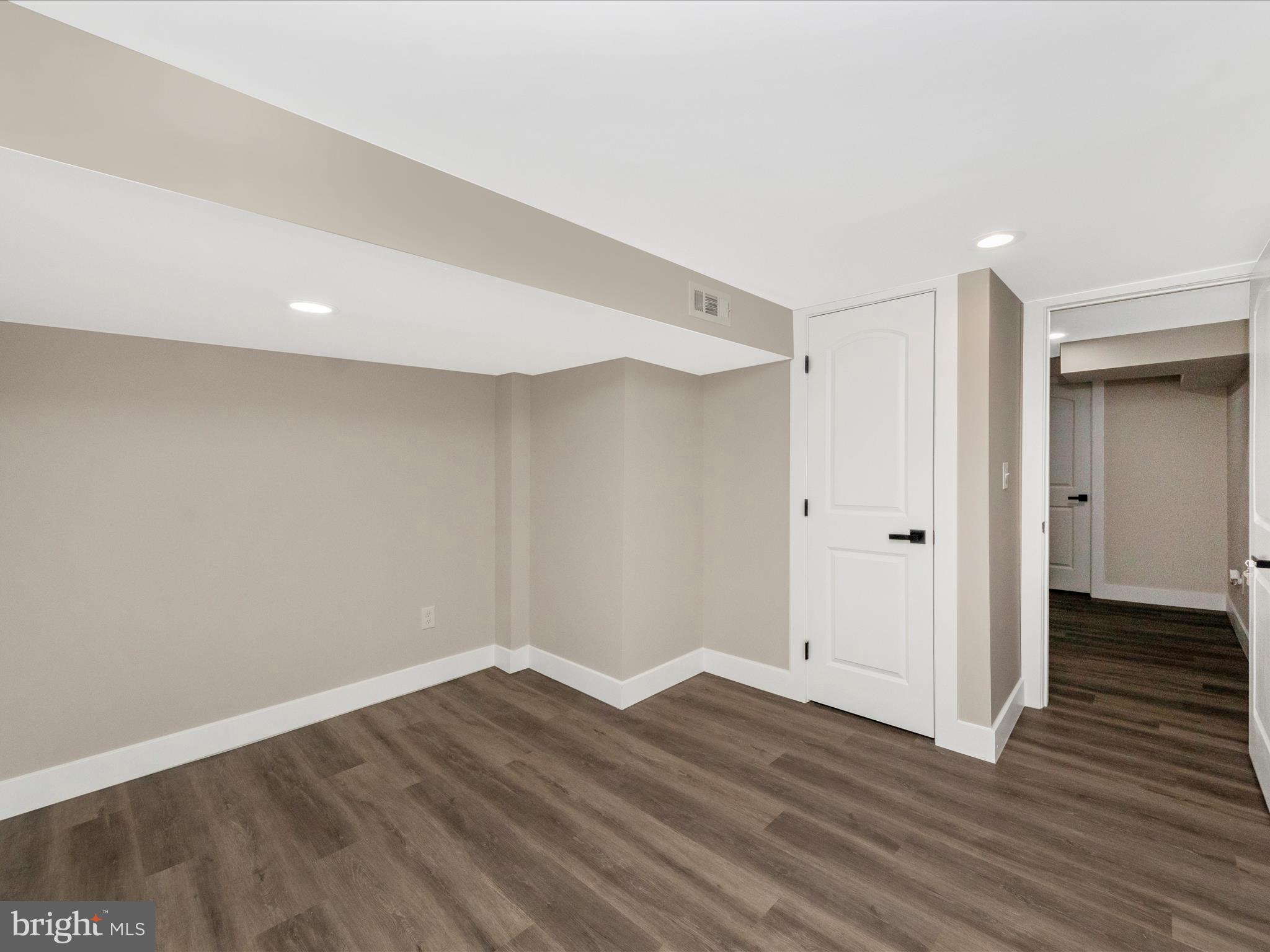 2812 Manoff Road Halethorpe, MD 21227 - Photo 32 of 55 a view of an empty room with wooden floor
