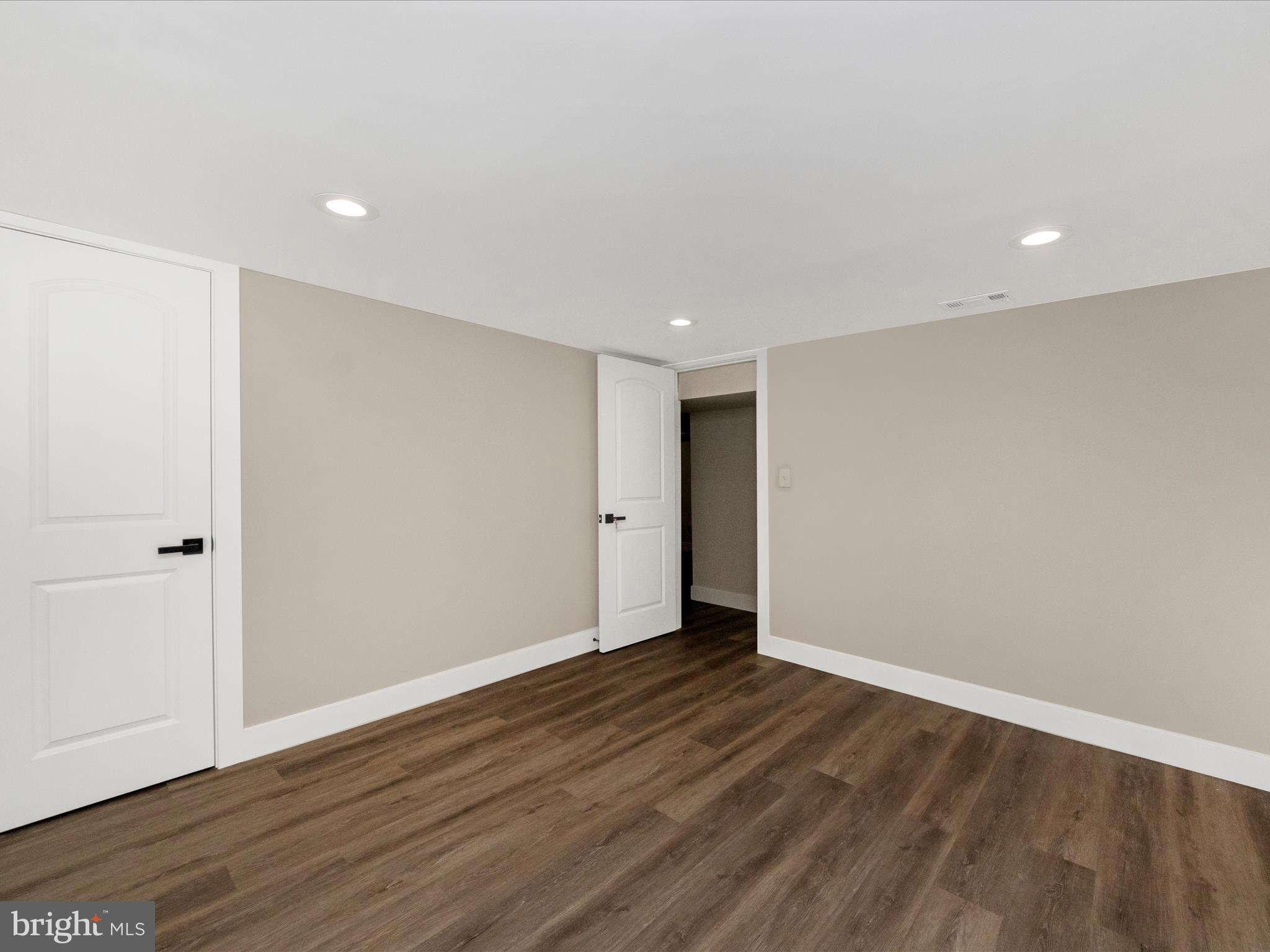 2812 Manoff Road Halethorpe, MD 21227 - Photo 34 of 55 a view of an empty room with wooden floor